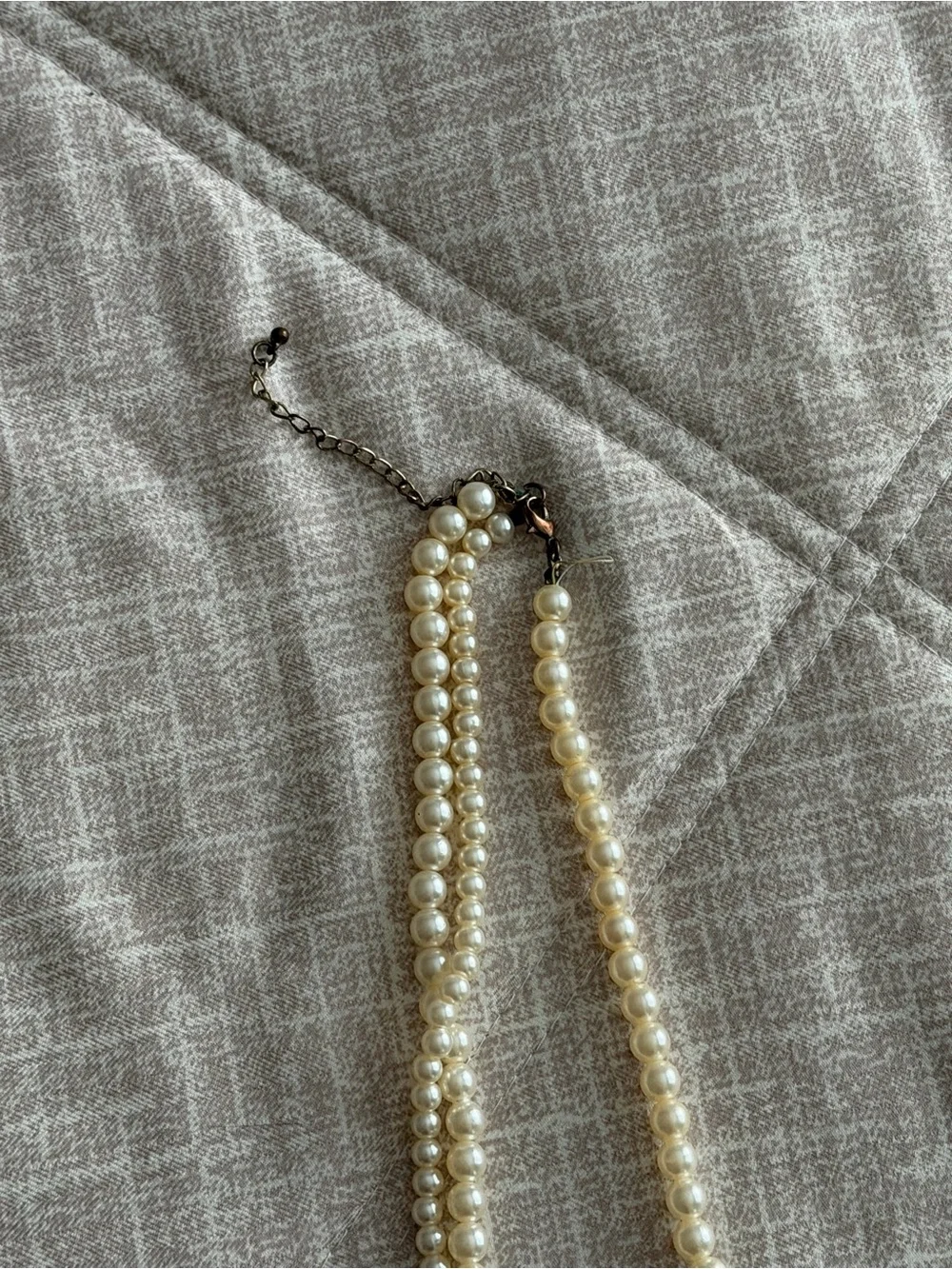 Long Pearl Strand Necklace with Black Floral Accents